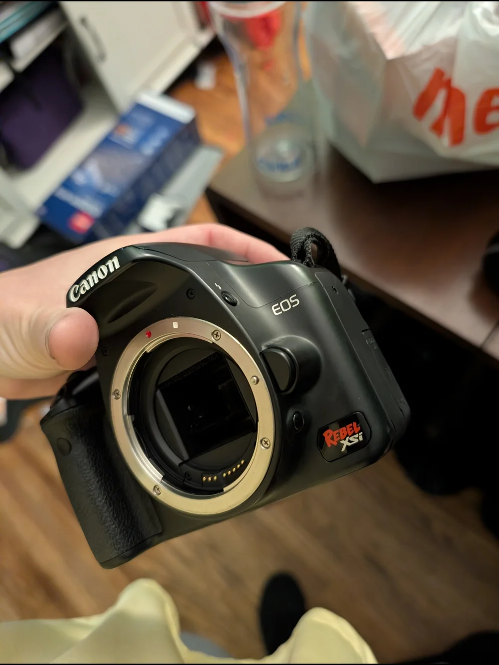 Canon DSLR Camera with Black Lenses and Charger